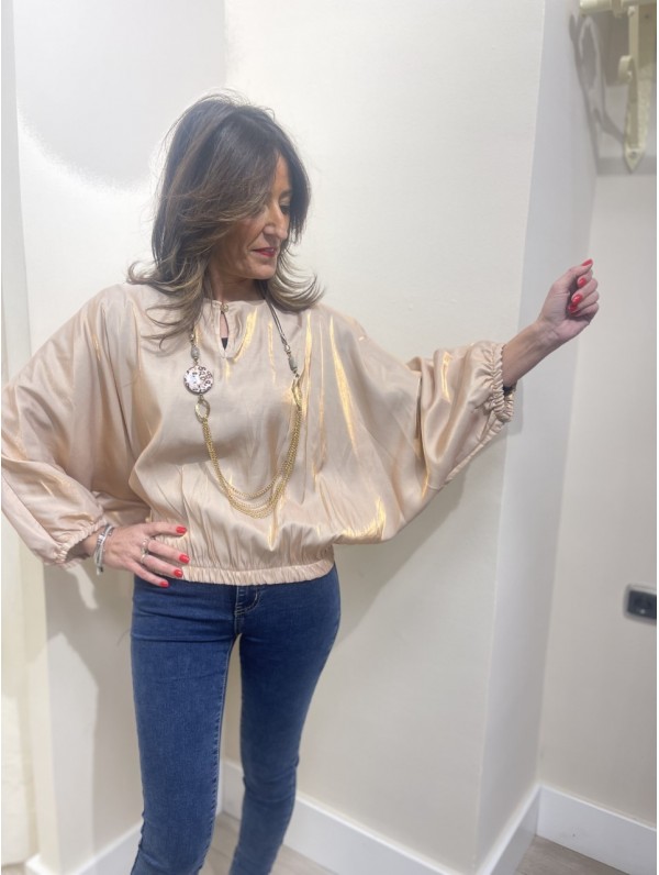Blusa dorada deals